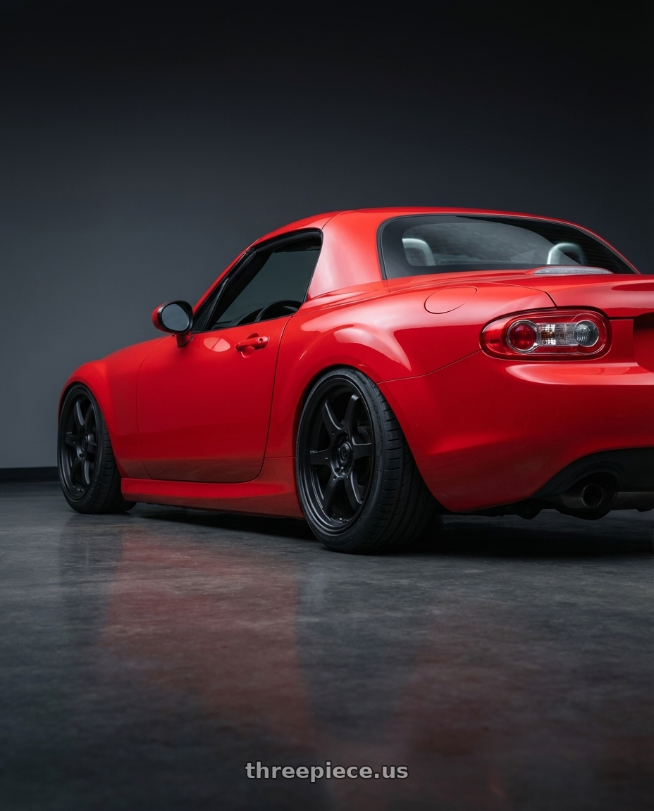 2012 Mazda MX-5 Miata NC with Konig Backbone 5x114.3 17x7.5+35 Matte Black Milling Logo on Spoke wheels rear three quarter view slight stretch tires
