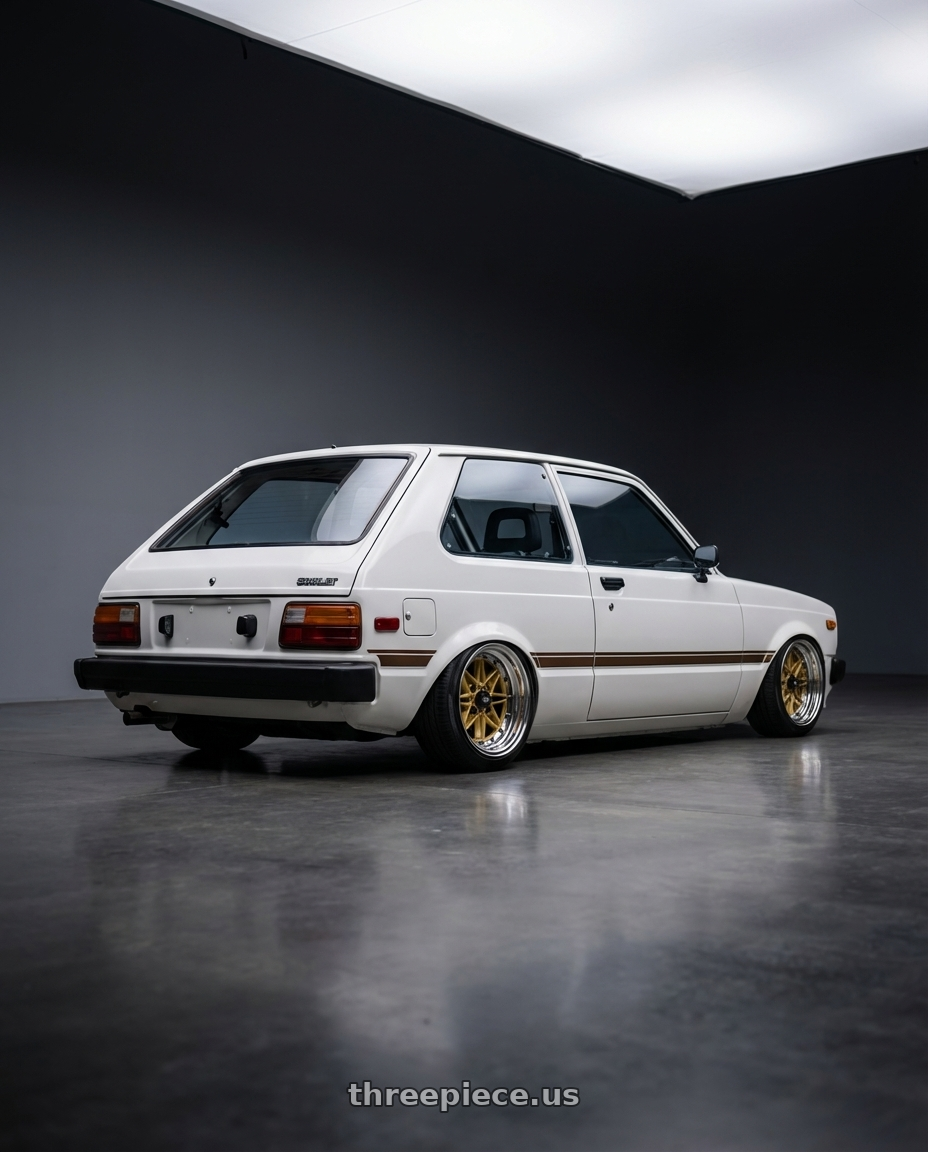 1981 toyota starlet with EQUIP 03 GOLD 15x8.5 -9 wheels rear three quarter view slight stretch tires
