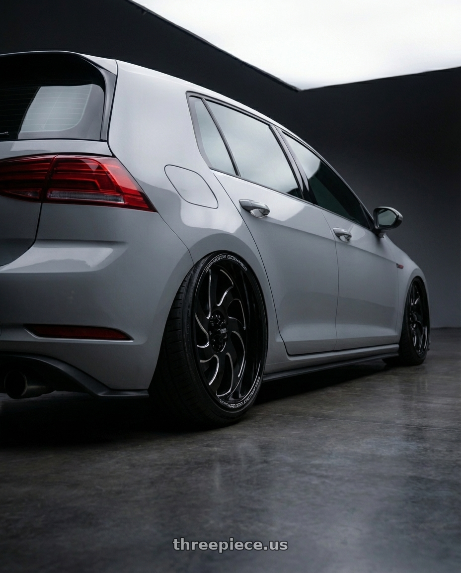 2019 VW MK7 Golf with Off Road Monster M07 5x127 20x10-19 Gloss Black Milled wheels rear three quarter view extreme stretch tires