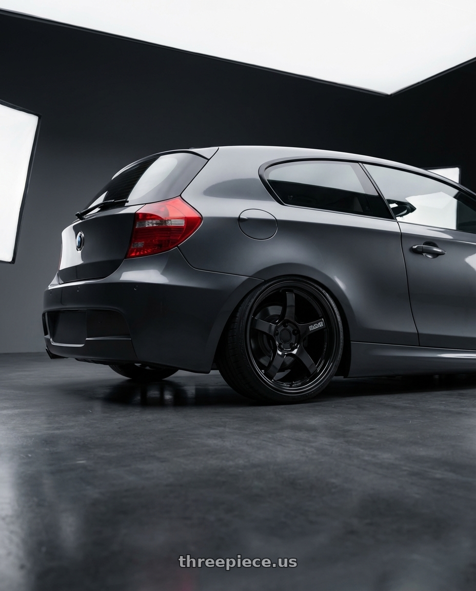 2012 BMW 1 Series E82 with Gram Lights 57CR 5x120 19x9.5+35 Glossy Black wheels rear three quarter view slight stretch tires