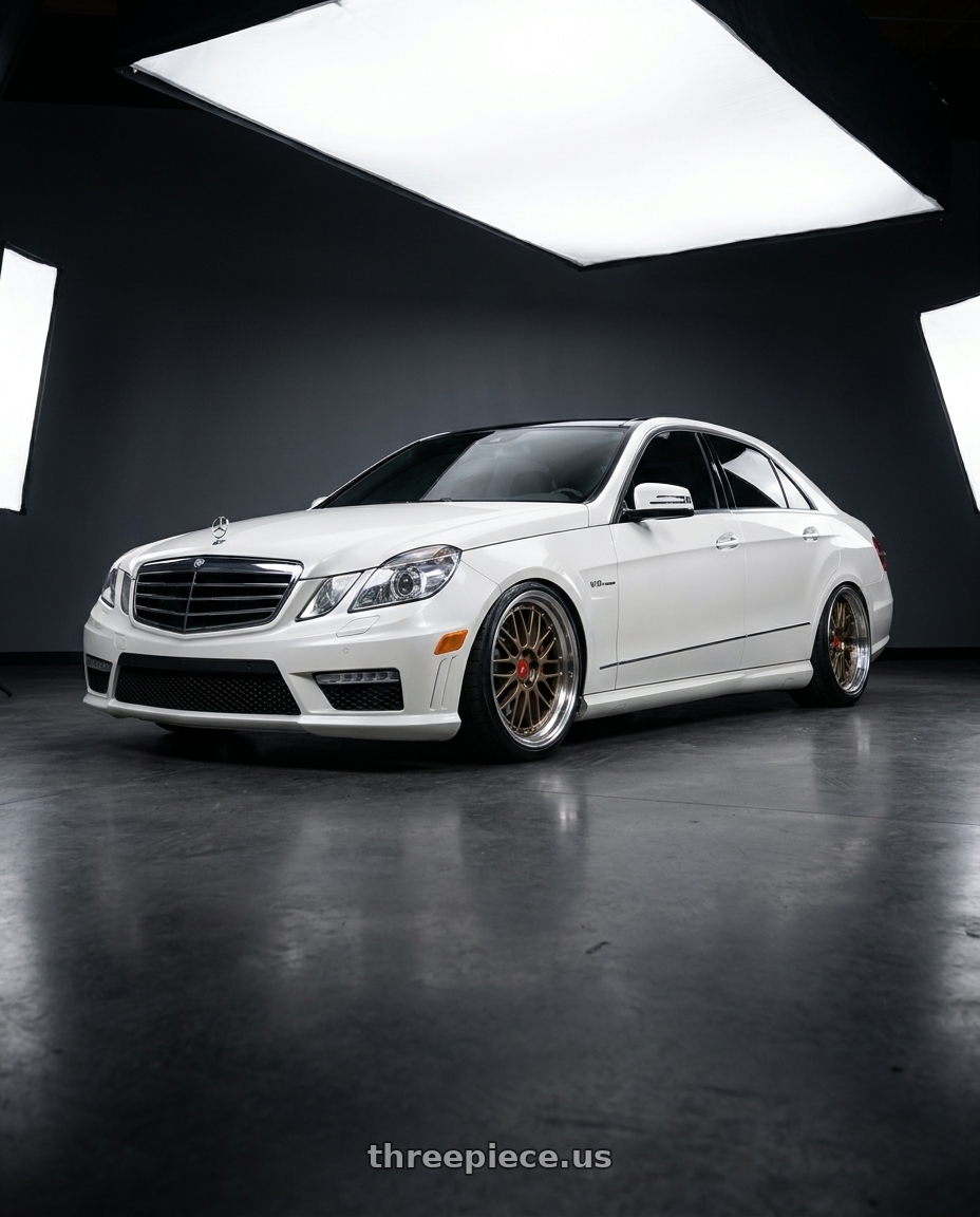 2012 Mercedes-Benz E63 AMG with BBS LM 5x112 20x11.0+24 Matte Bronze wheels front three quarter view lowered stance