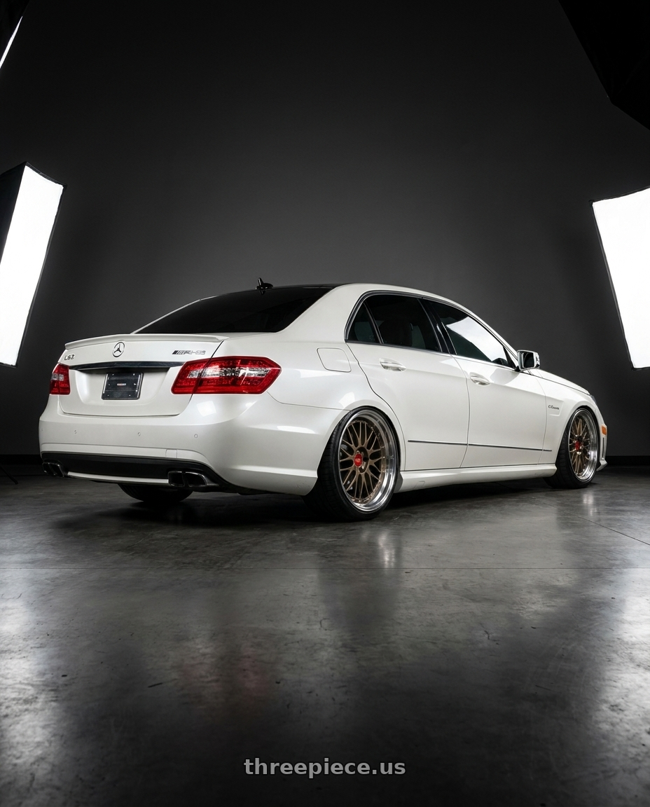 2012 Mercedes-Benz E63 AMG with BBS LM 5x112 20x11.0+24 Matte Bronze wheels rear three quarter view extreme stretch tires
