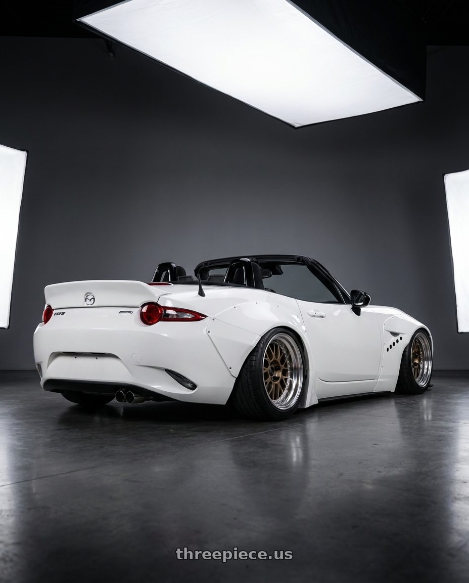 2016 Mazda mx5 with Work Meister M1 3p 4x100 16x9-20 O Disk Titanium Gold wheels rear three quarter view slight stretch tires
