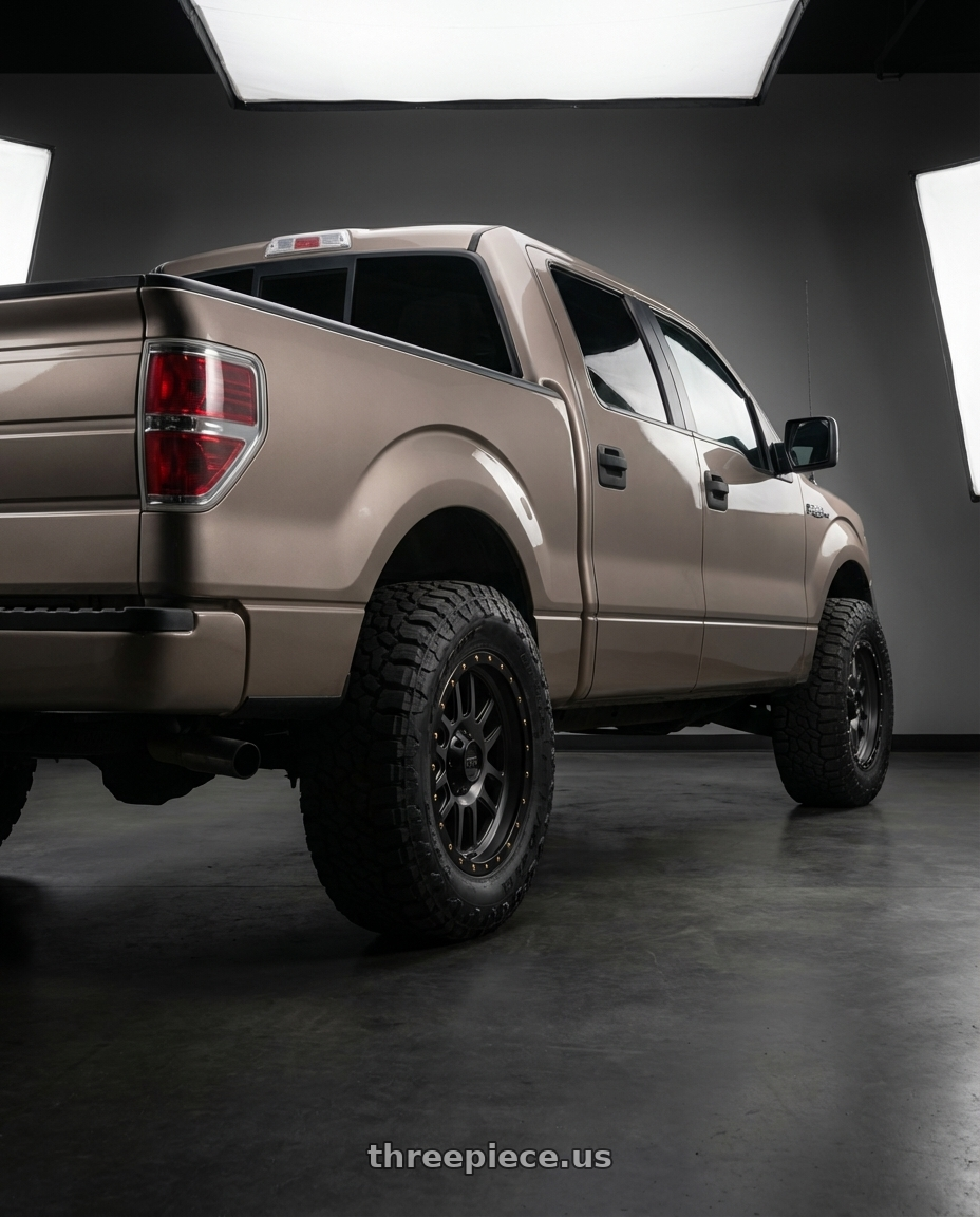 2013 Ford F-150 with KMC KM101 TEMPO 6X135/6X139.7 20X9 +18 SATIN BLACK WITH GRAY TINT wheels rear three quarter view meaty tires