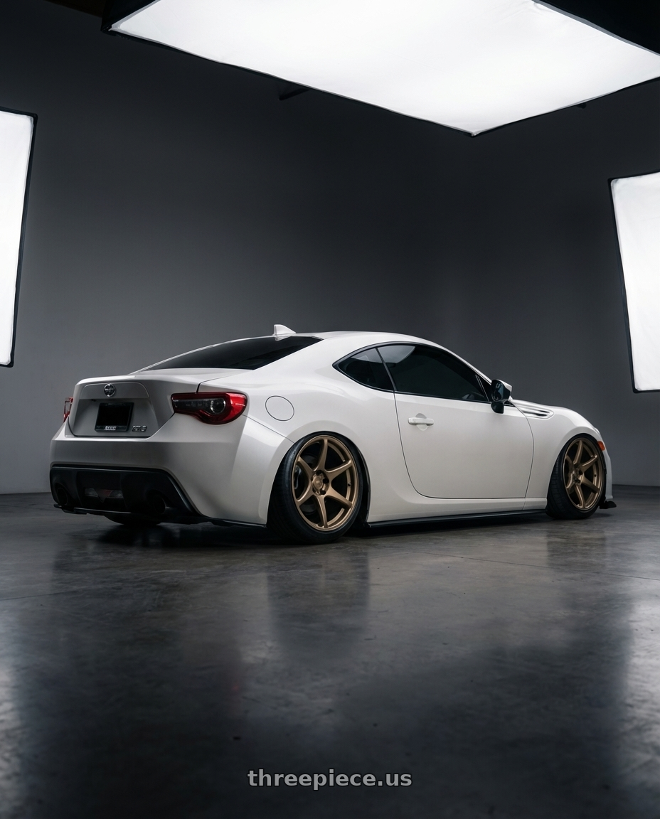 2016 Scion FR-S with Kansei K11B Tandem 5X100 18x9.5 22 Bronze wheels rear three quarter view slight stretch tires