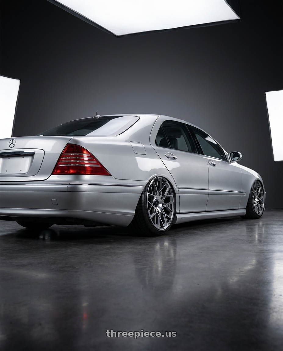 2006 Mercedes S65 AMG with Status ST005 MATRIX 5X120/5X127 22X9.5 +30 ANTH-MIR wheels rear three quarter view extreme stretch tires