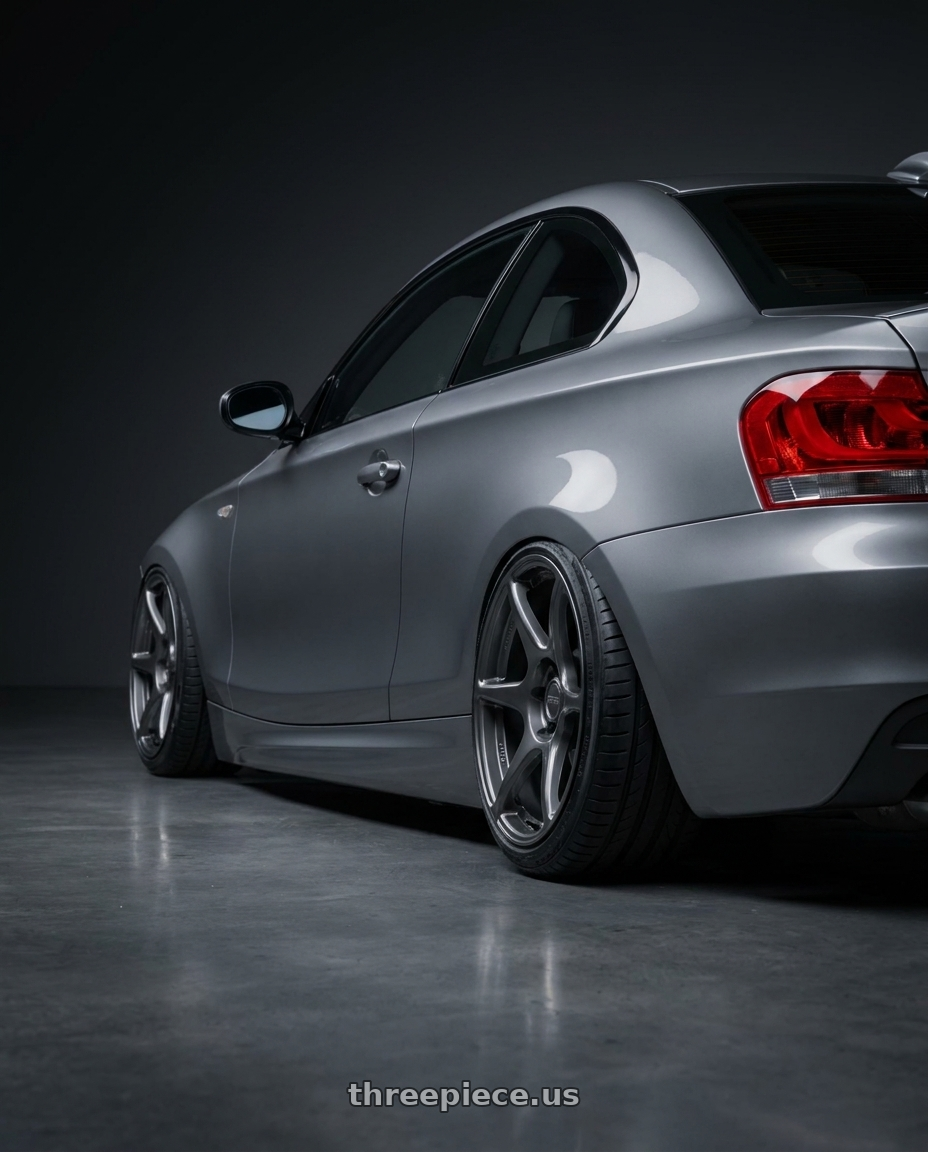 2012 BMW 1 Series E82 with Kansei K11G Tandem 5X120 18x9.5 22 Gunmetal wheels rear three quarter view slight stretch tires