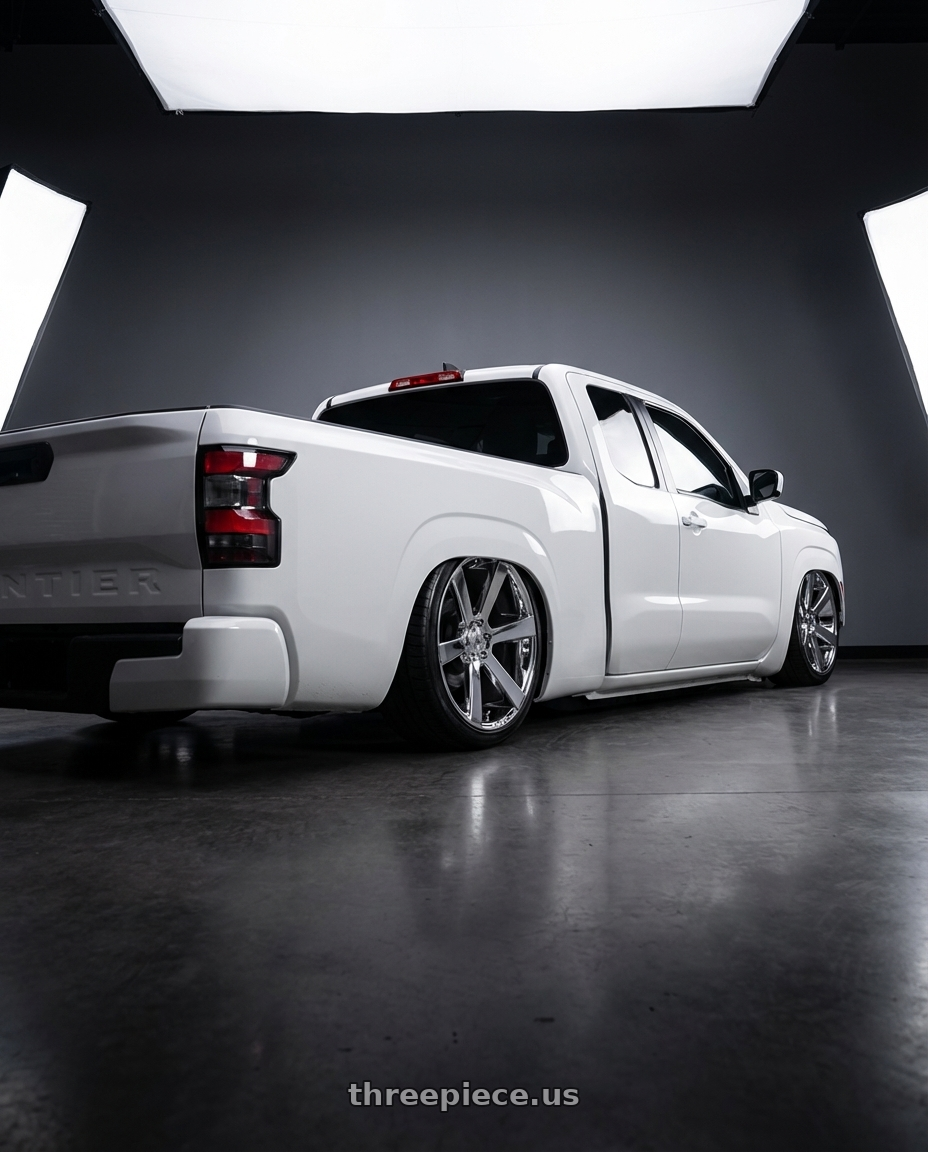 2025 Nissan frontier kingcab white base model with Asanti Black ABL-15 APOLLO 6X139.7 24X9 +15 CHROME wheels rear three quarter view slight stretch tires