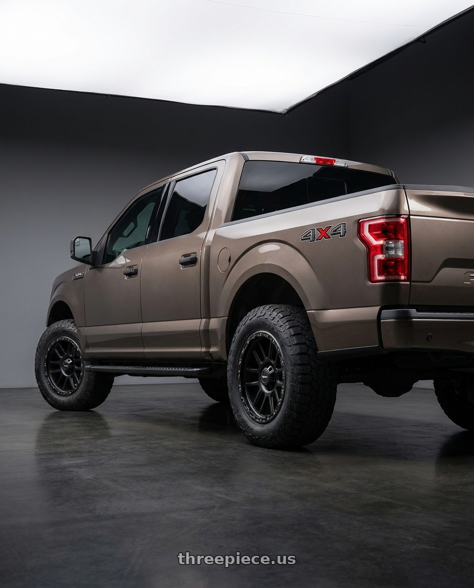 2019 Ford F-150 with Vision Off-Road 111 Nemesis 6x135 20x9+18 Matte Black wheels rear three quarter view meaty tires