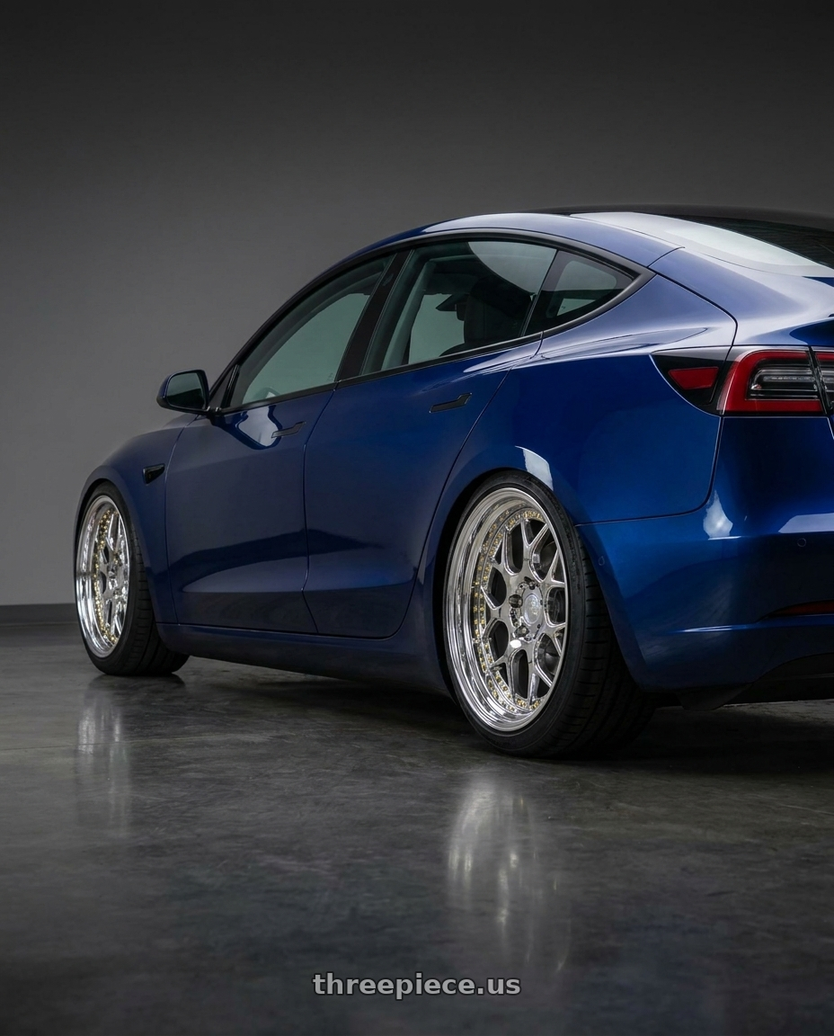 2023 Tesla model 3 with Aodhan DS01 5x114.3 18x9.5+30 Vacuum Chrome W/ Gold Rivets wheels rear three quarter view square tires