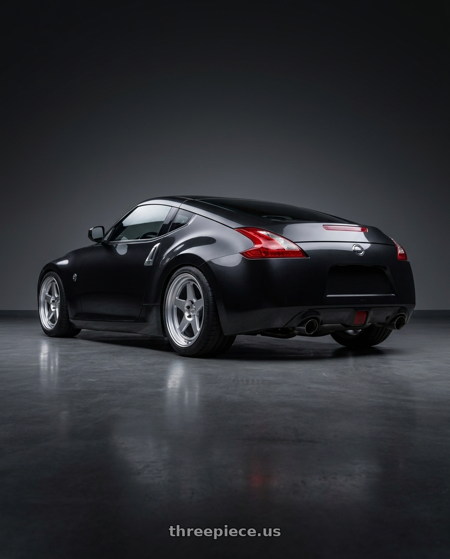 2009 Nissan 370z Magnetic Black Metallic  with Kansei K12H KNP 5x114.3 18x10.5 12 Hyper Silver wheels rear three quarter view meaty tires