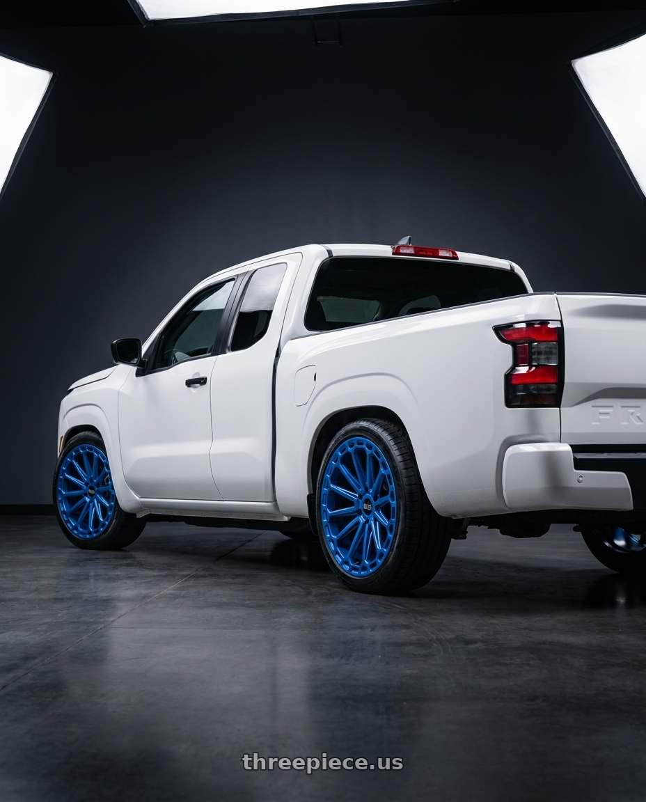 2025 nissan frontier king cab with Black Rhino KAIZEN 6X114.3 20X9.5 +18 DEARBORN BLUE wheels rear three quarter view slight stretch tires