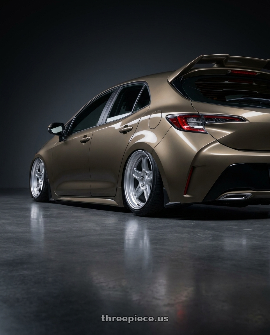 2019 Corolla hatch xse oxidize bronze with spoiler with Kansei K11S Tandem 5X100 17x9 35 Hyper Silver wheels rear three quarter view slight stretch tires