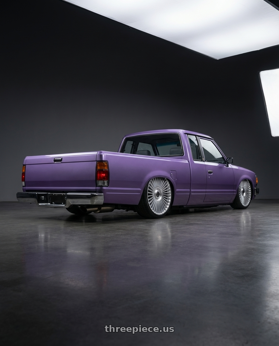 1985 nissan 720 with DOLCE LUXURY TRENTO 6x135/6x139.7 22x9.5 +35 Glossy Silver Brush Face wheels rear three quarter view square tires