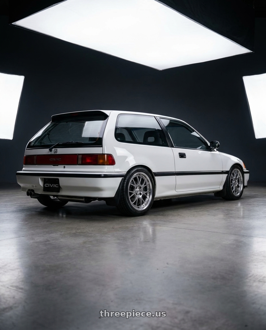 1990 Honda Civic with SSR Professor MS3R 4X100 16X7 39 SL Disk Titan Silver wheels rear three quarter view square tires