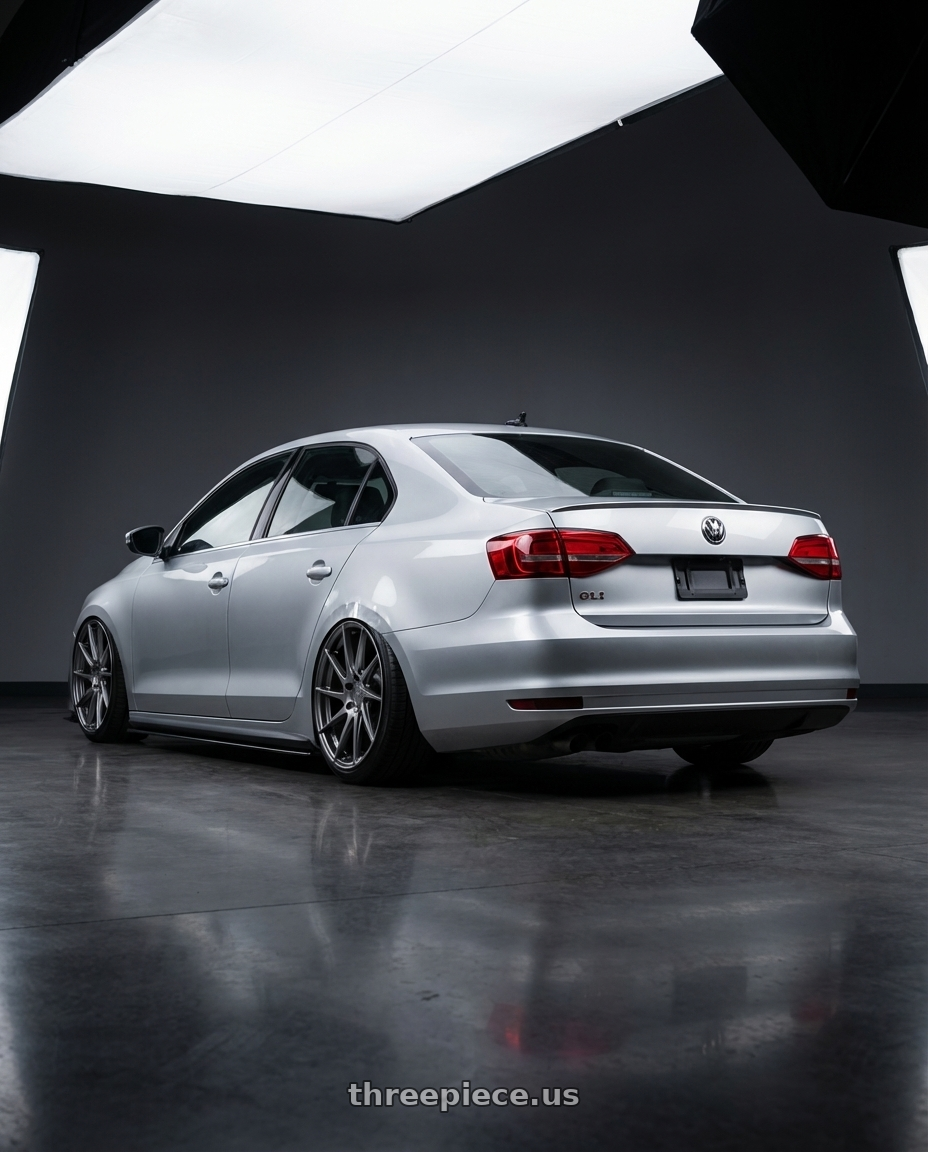 2016 Volkswagen Jetta GLI MK6 with Aodhan AH09 5x112 18x9.5 +35 Hyper Black wheels rear three quarter view slight stretch tires