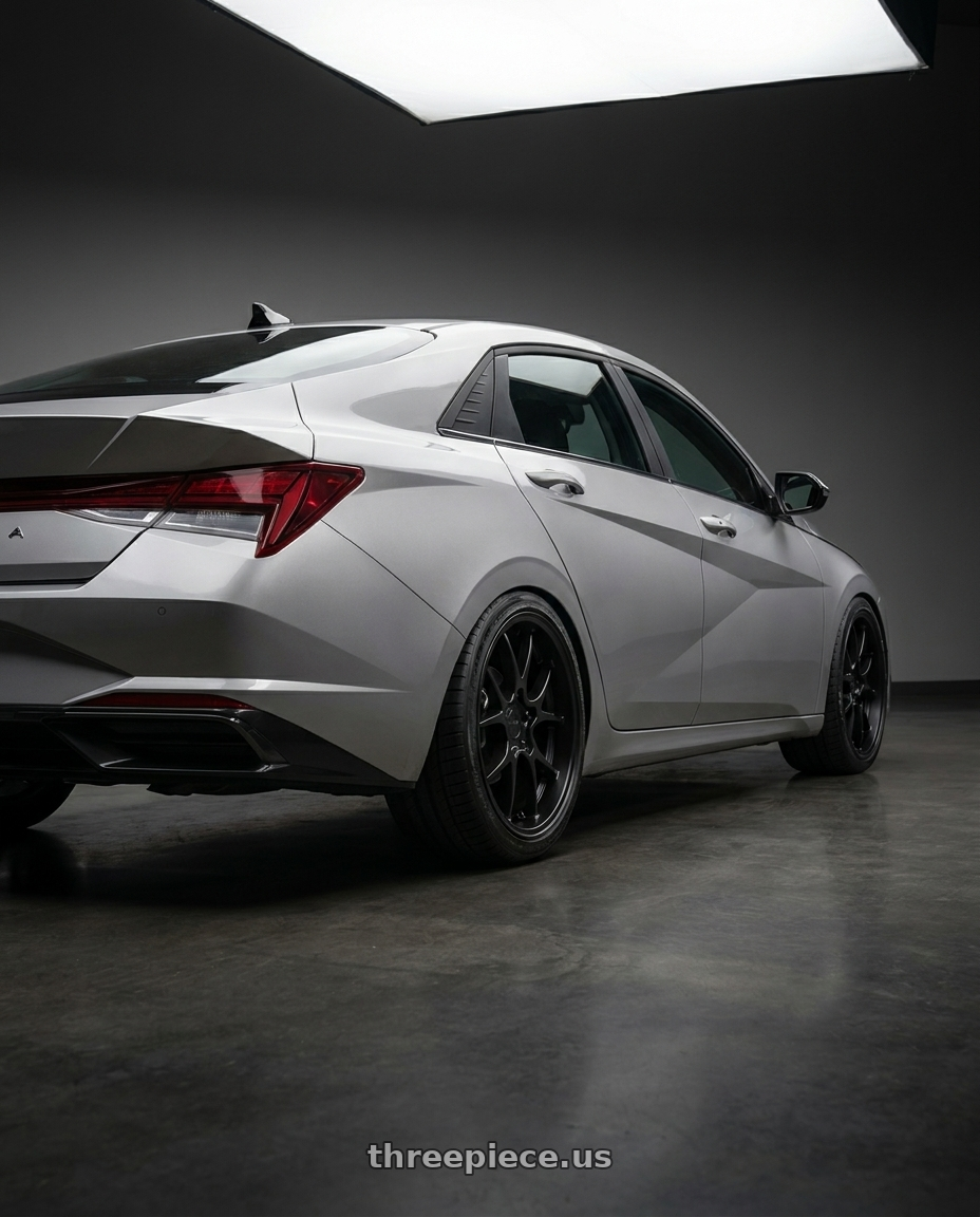 2021 Hyundai Elantra Limited with Rotiform 207 5x114.3 19x8.5 +35 MATTE BLACK wheels rear three quarter view square tires