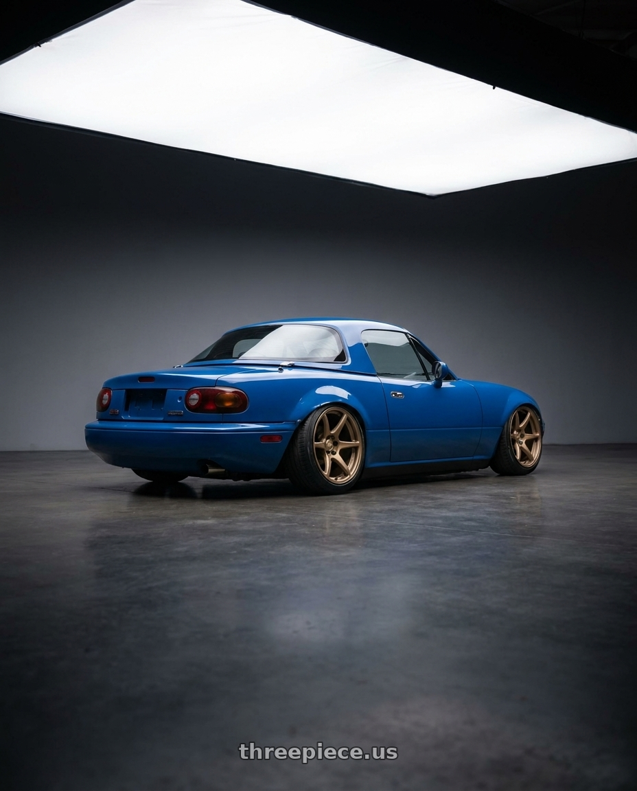 1991 Mazda miata with Kansei K11B Tandem 5x114.3 19x9.5 12 Bronze wheels rear three quarter view slight stretch tires