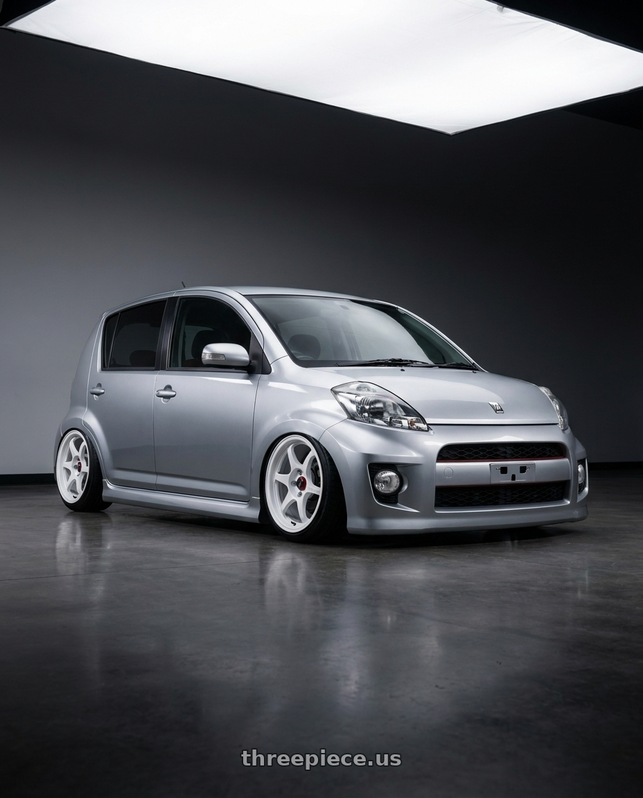 2010 Toyota passo racy with Enkei PF06 4x100 15x8+25 White Machined wheels