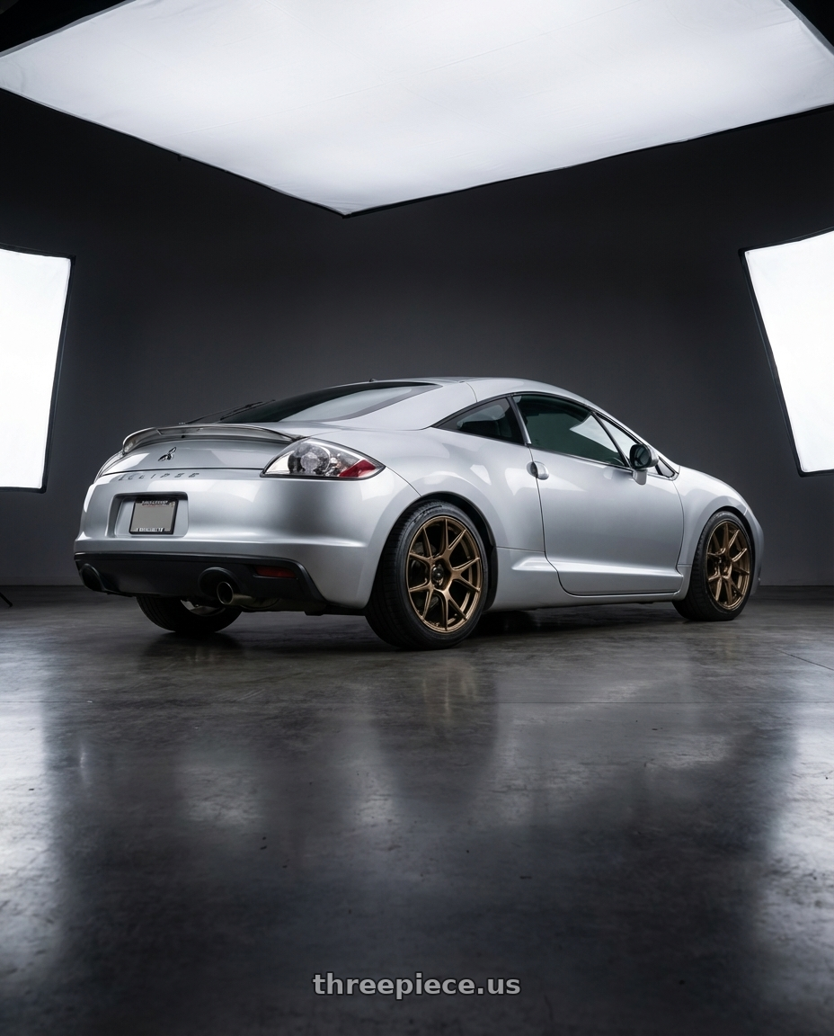 2010 Mitsubishi Eclipse with Konig Ampliform 5x114.3 18x9.5+35 Gloss Bronze wheels rear three quarter view square tires