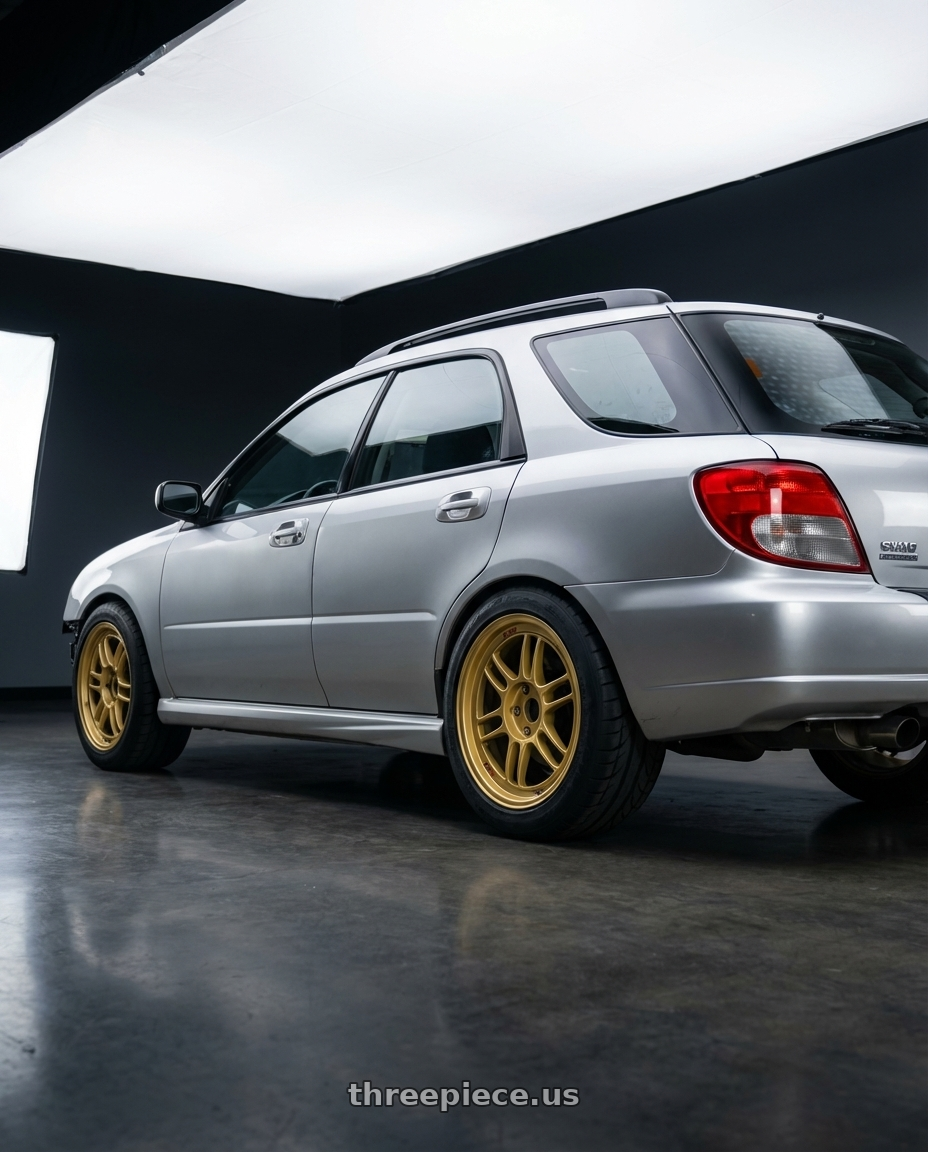 2006 Subaru Impreza wagon  with Enkei RPF1 5x100 17x8+45 Gold wheels rear three quarter view meaty tires