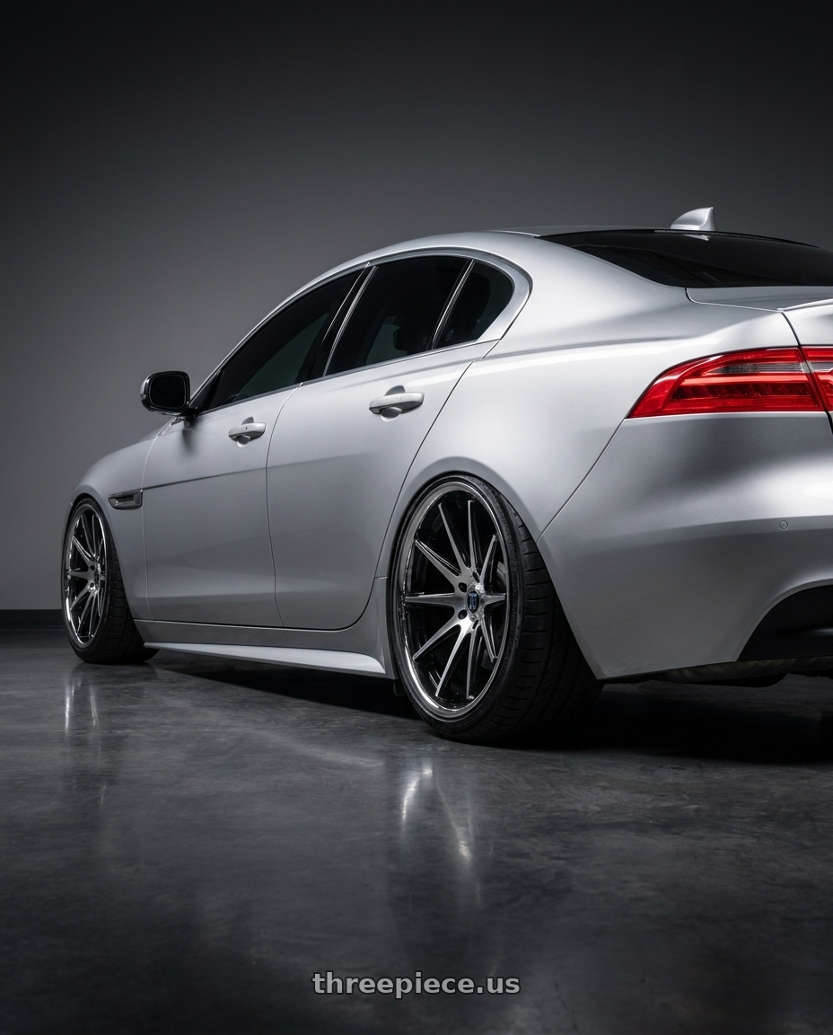 2017 Jaguar Xe with Rohana RFC10 5x112 20x9+35 Machine Black/Chrome Lip wheels rear three quarter view meaty tires