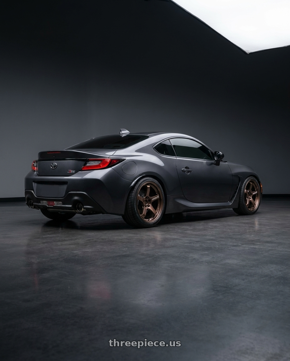 2026 Toyota gr86 with Advan Racing GT BEYOND 5x100 18x9.5 +45 RACING COPPER BRONZE wheels rear three quarter view square tires