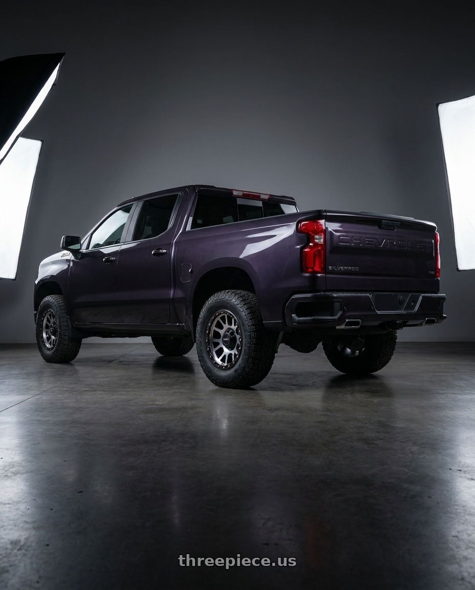 2023 Chevrolet Silverado 1500 with Vision Off-Road 111 Nemesis 6x139.7 20x9+12 Matte Black Machined Face wheels rear three quarter view meaty tires