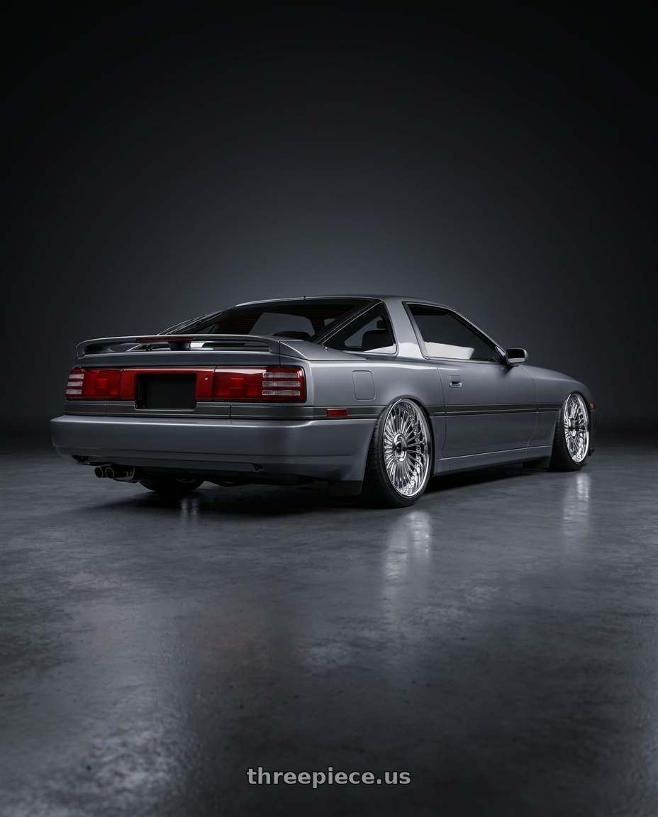 1988 Toyota Supra Gray 3 with Work Emitz 5x114.3 Chrome 20x11.5 +38 wheels rear three quarter view slight stretch tires