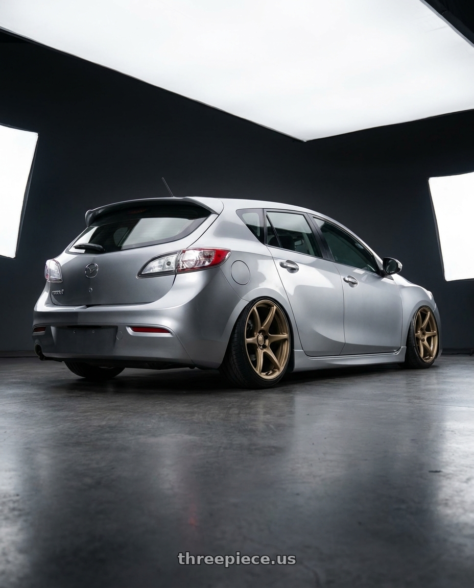 2013 Mazda 3 Skyactiv Silver with Kansei K11B Tandem 5X112 19x10.5 22 Bronze wheels rear three quarter view slight stretch tires