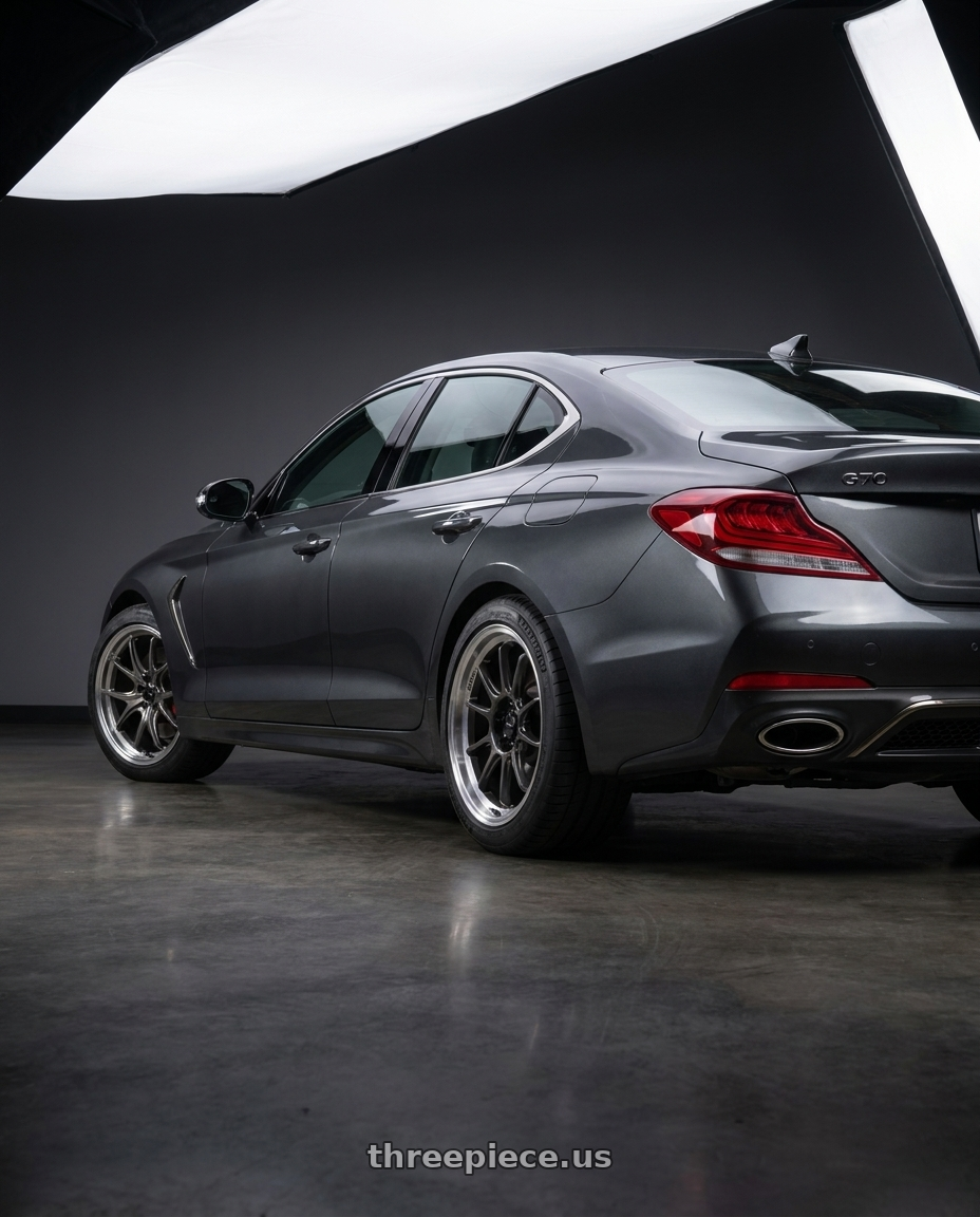 2019 Genesis G70 with Konig 47MC Hypergram 5x114.3 17x8 +35 Metallic Carbon Machined Lip wheels rear three quarter view square tires