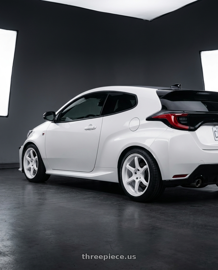 2025 Toyota GR Yaris with Rotiform BPU 5x114.3 18x8.5 +35 Gloss White wheels rear three quarter view square tires