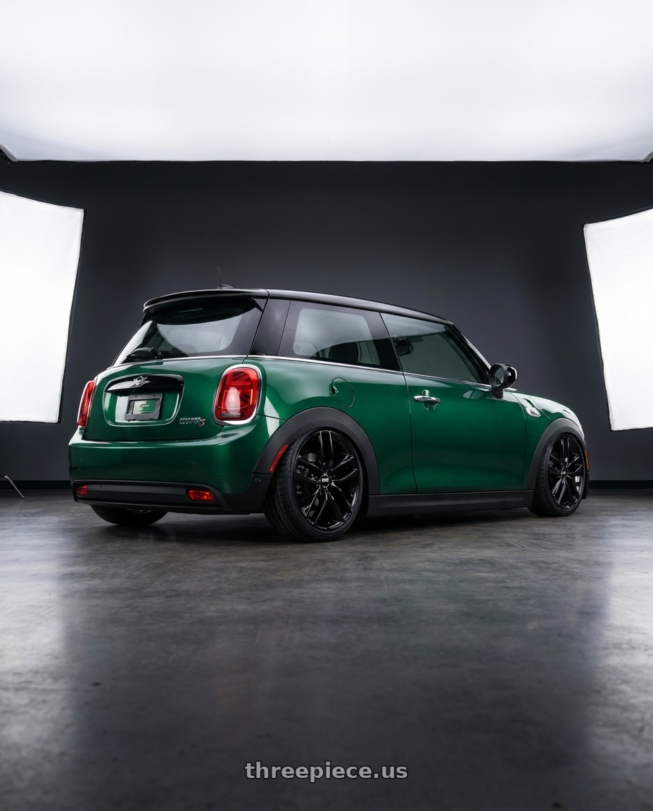 2022 Mini cooper s britisch green iv with BBS SX 5x112 18x8.0+44 Crystal Black wheels rear three quarter view slight stretch tires