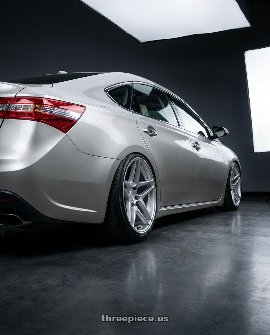 2013 toyota avalon with Kansei K15H Astro 5x114.3 19x9.5 35 Hyper Silver wheels rear three quarter view extreme stretch tires