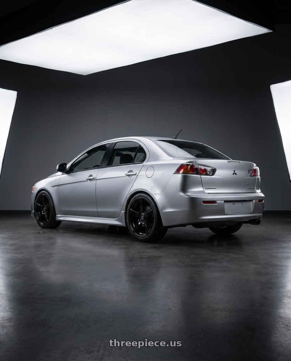 2014 Mitsubishi Lancer Ralliart with Forgestar CF5 5x114.3 18x9 +35 Gloss Black wheels rear three quarter view square tires