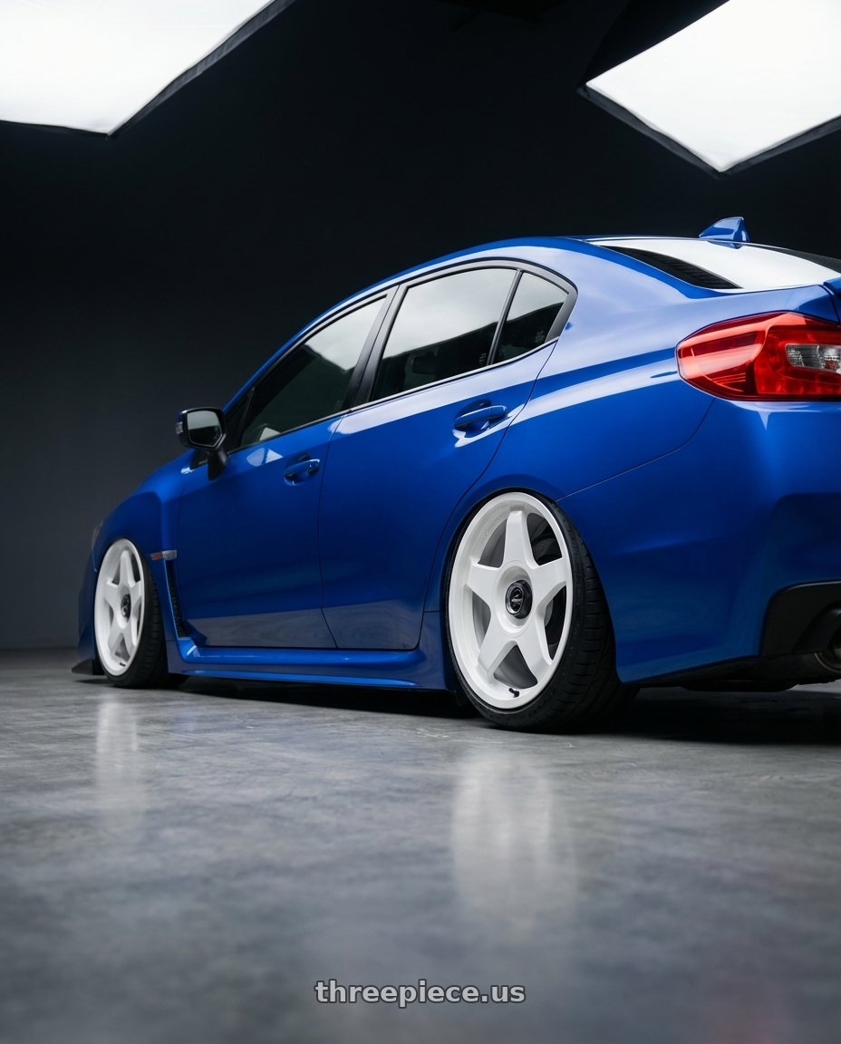 2013 Subaru WRX STI with fifteen52 CHICANE 5x114.3 / 5x100 18x8.5 +35 RALLY WHITE (GLOSS WHITE) wheels rear three quarter view slight stretch tires