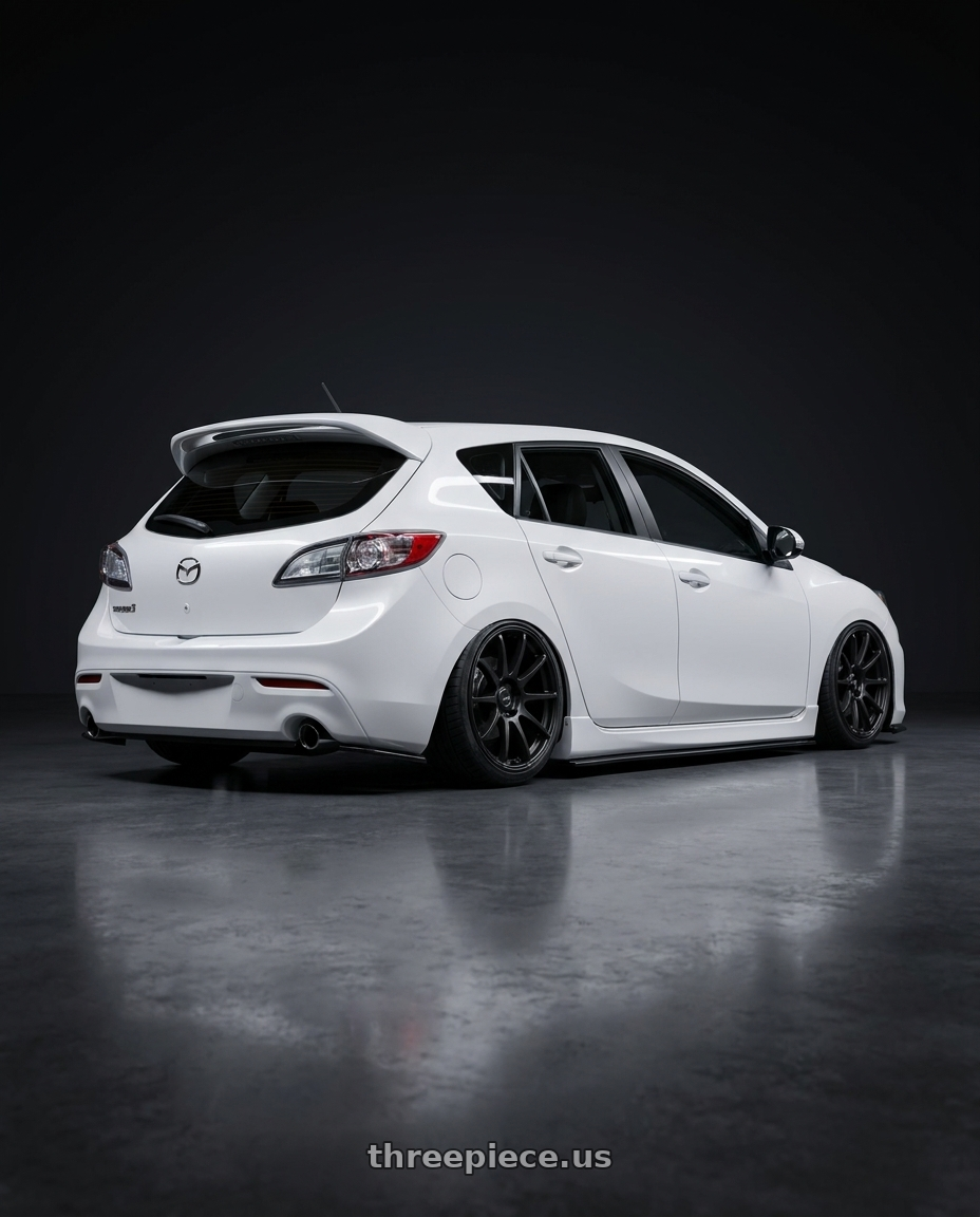 2012 Mazda Mazdaspeed3 with Ssr Gtv02 5x114.3 18x8.5+40  FLAT BLACK wheels rear three quarter view slight stretch tires