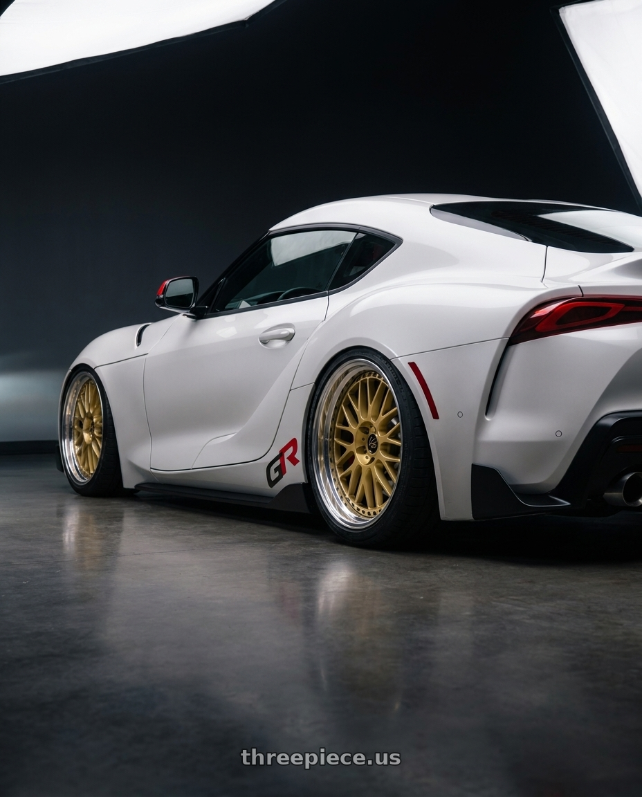 2026 toyota GR supra final with Work Vs-Xx 5x112 19x8.5+32 O Disk Gold wheels rear three quarter view square tires