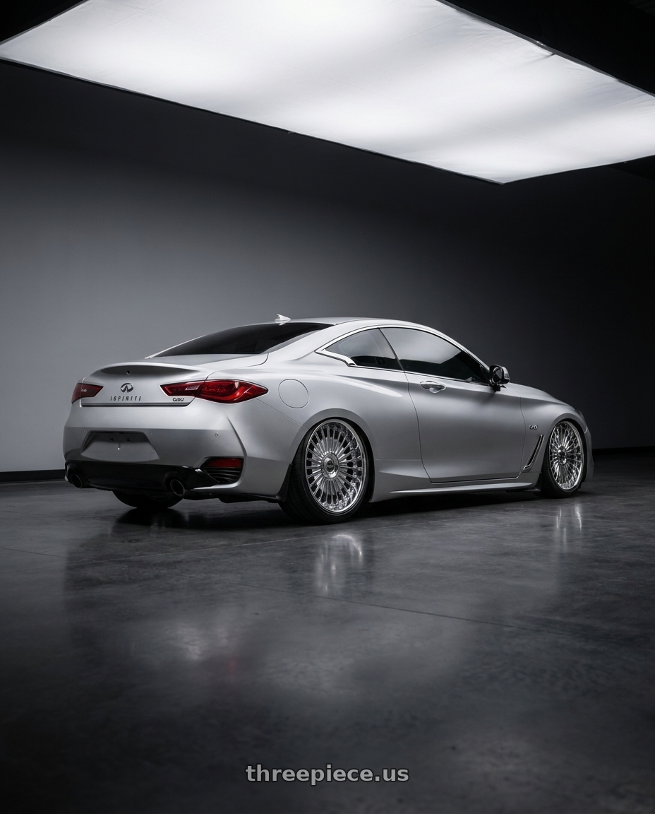 2018 infiniti Q60 Luxe with Work Emitz Chrome 5x114.3 19x9.5 +38 wheels rear three quarter view slight stretch tires
