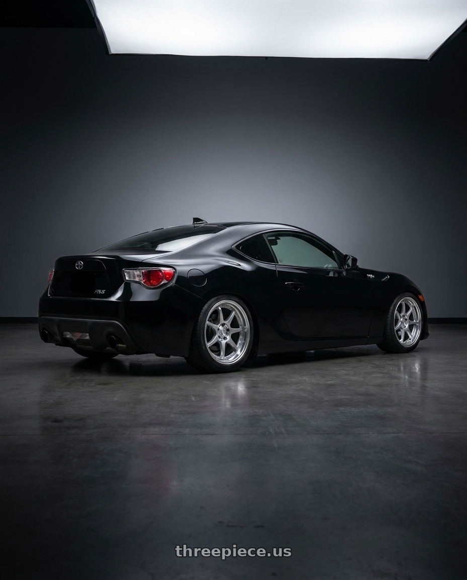 2013 scion frs base black with FORMULA AERO MESH 5X100 18X9.5+35 MD Disk Titan Silver wheels rear three quarter view square tires