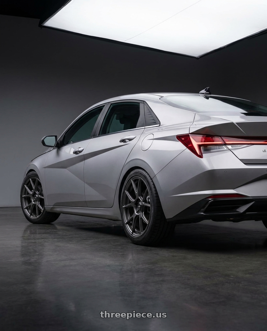2021 Hyundai Elantra Limited with Konig Ampliform 5x114.3 18x8.5+45 Dark Metallic Graphite wheels rear three quarter view square tires