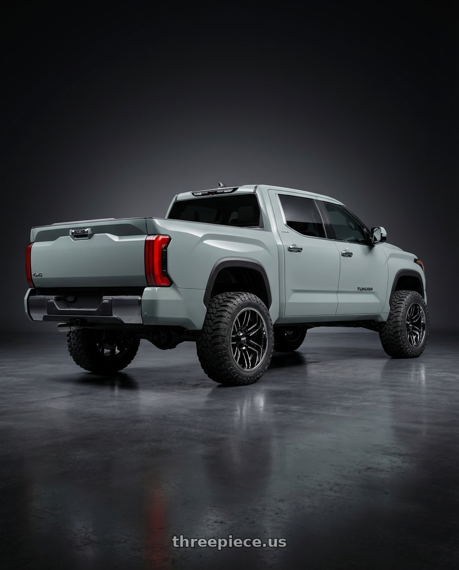 2024 Toyota Tundra with Moto Metal MO202 6X139.7 22X12 -44 GLOSS BLACK MACHINED CENTER CHROME LIP wheels rear three quarter view meaty tires