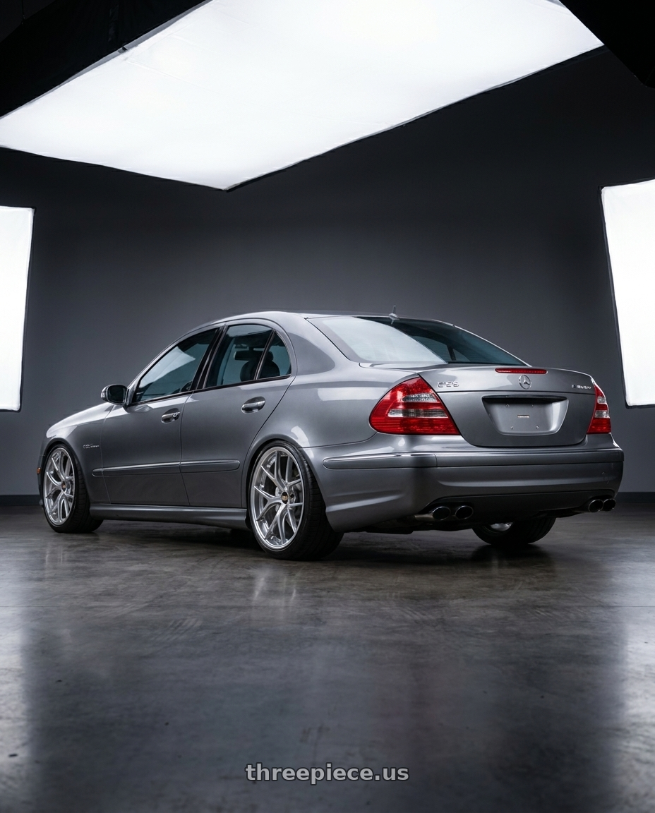 2006 Mercedes E55 AMG with BBS RI-S 5x120 20x10.0+34 Diamond Silver wheels rear three quarter view extreme stretch tires