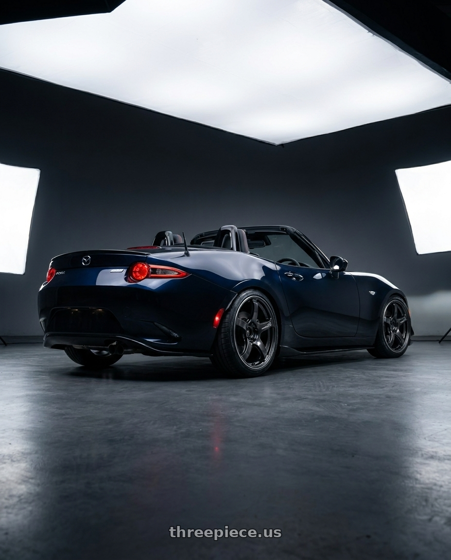2021 Mazda Mx5 with Advan Racing TC4 4x100 17x7.0 +47 BLACK GUNMETALLIC & RING wheels rear three quarter view slight stretch tires