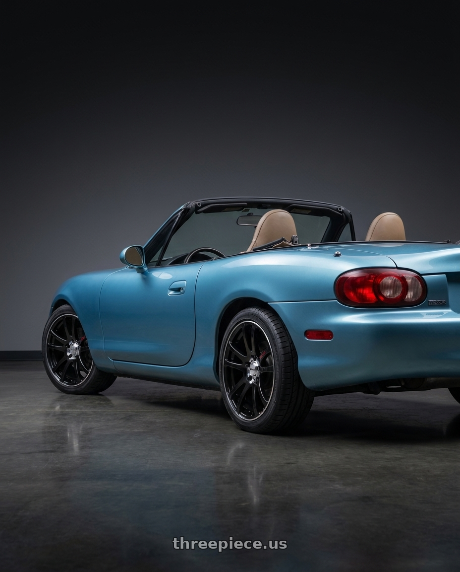 2002 Mazda Miata with RTX Twin 4x100 15x6.5 +38 Black Machined wheels rear three quarter view square tires