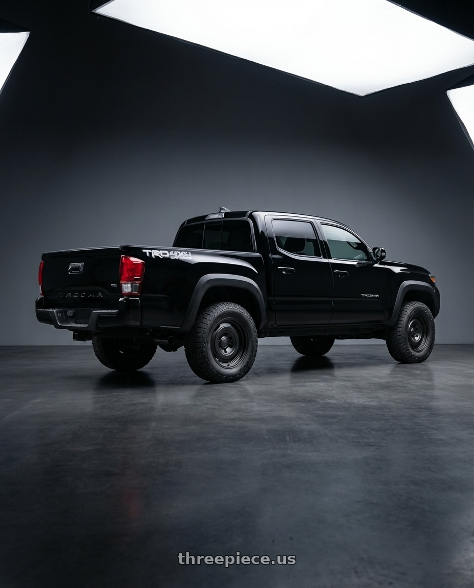 2016 Toyota Tacoma with fifteen52 ANALOG HD 6x139.7 17x8.0 +25 ASPHALT BLACK (SATIN BLACK) wheels rear three quarter view square tires