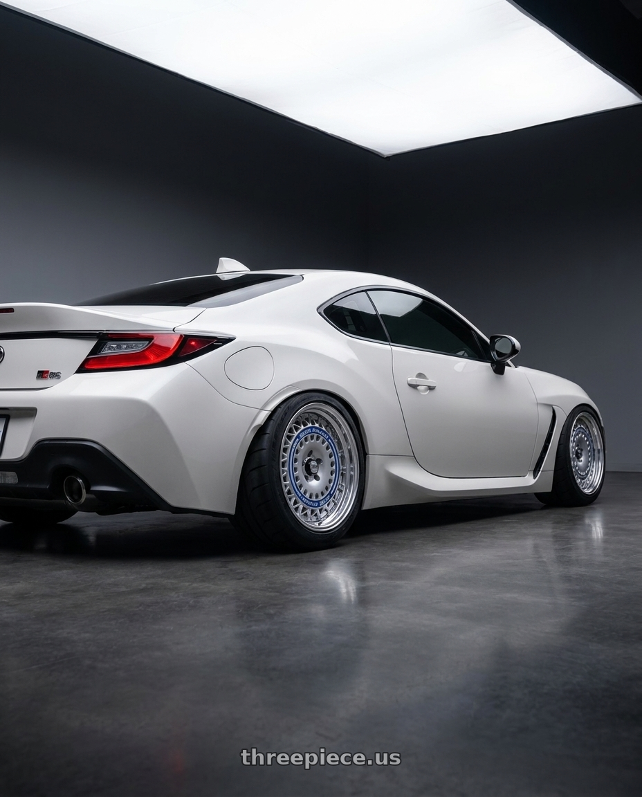 2022 Toyota GR86 with FORMULA AERO MESH 5X100 18X9.5+25 HP Disk Titan Silver wheels rear three quarter view meaty tires