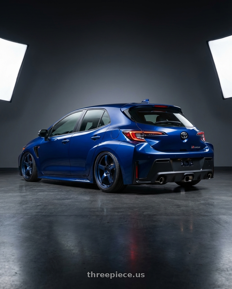 2024 Toyota GR Corolla with Gram Lights 57CR 5x114.3 18x9.5+22 Eternal Blue Pearl wheels rear three quarter view slight stretch tires