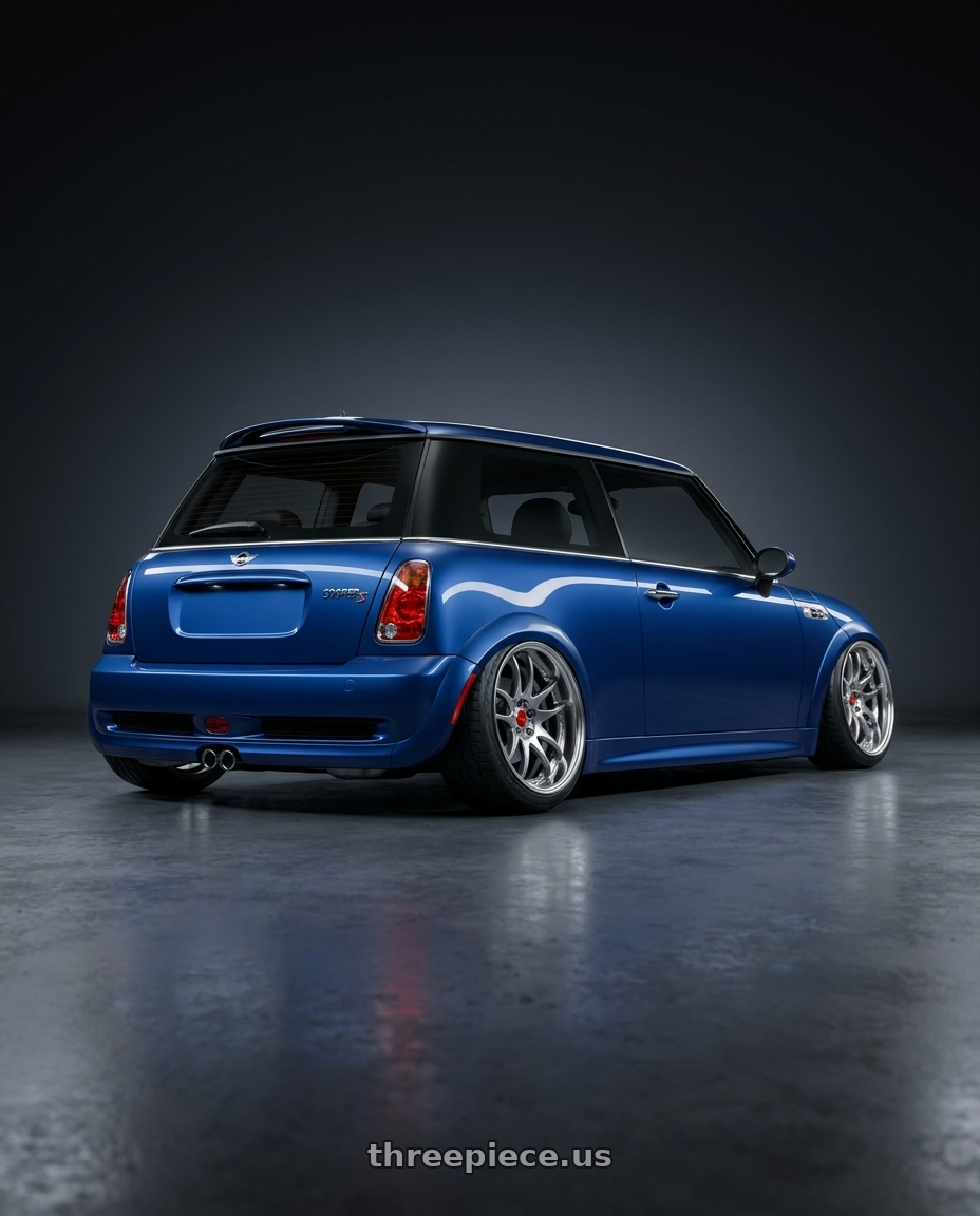 2003 mini cooper s with Work Cr 2P 4x100 17x8.5 +38 GT Silver wheels rear three quarter view extreme stretch tires