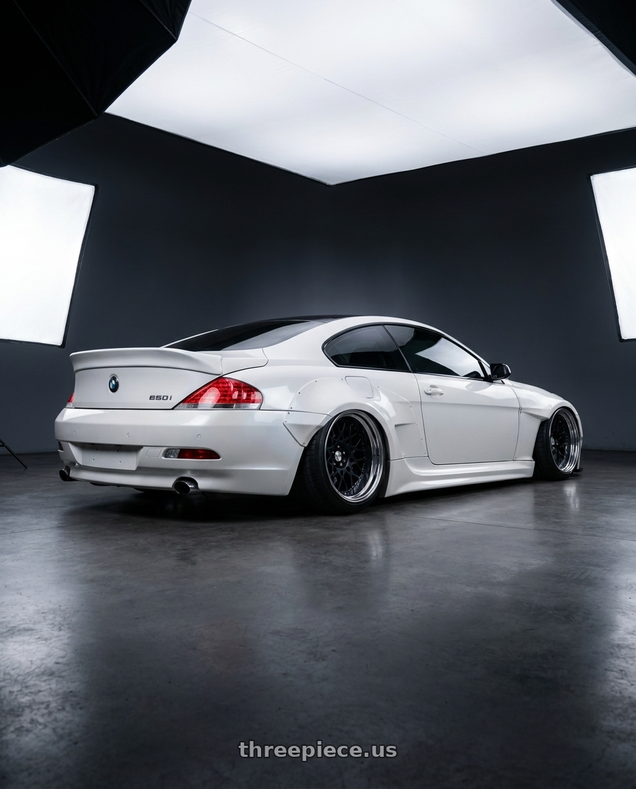 2006 BMW 650i with Work Seeker Cx 4x100 18x11.5+0 R Disk Matte Black wheels rear three quarter view extreme stretch tires